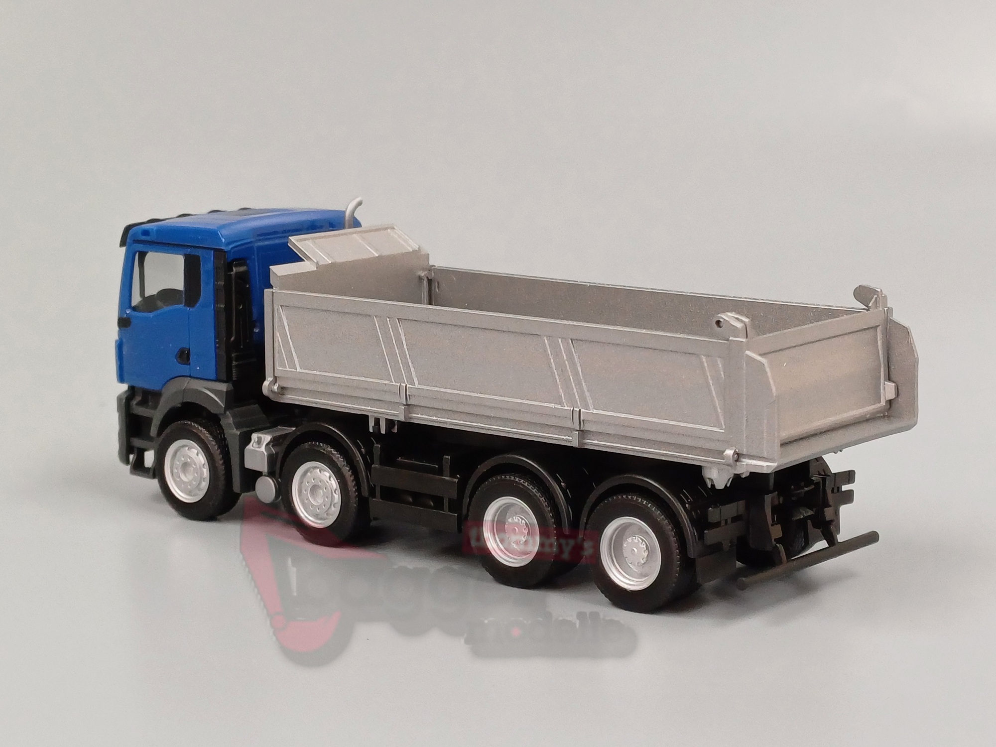 319140 - Herpa - MAN TGS NN Baukipper 4-achs, blau/silber